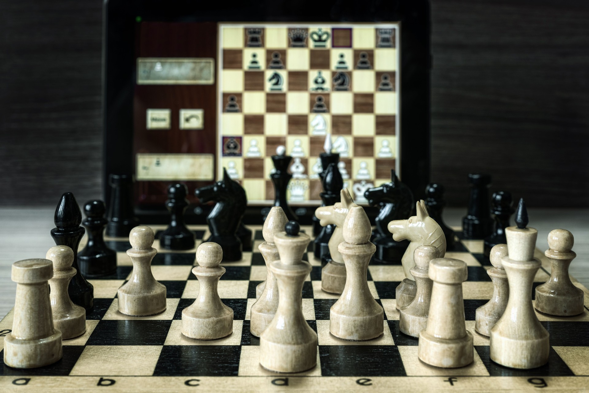 Playing chess with a computer, selective focus.